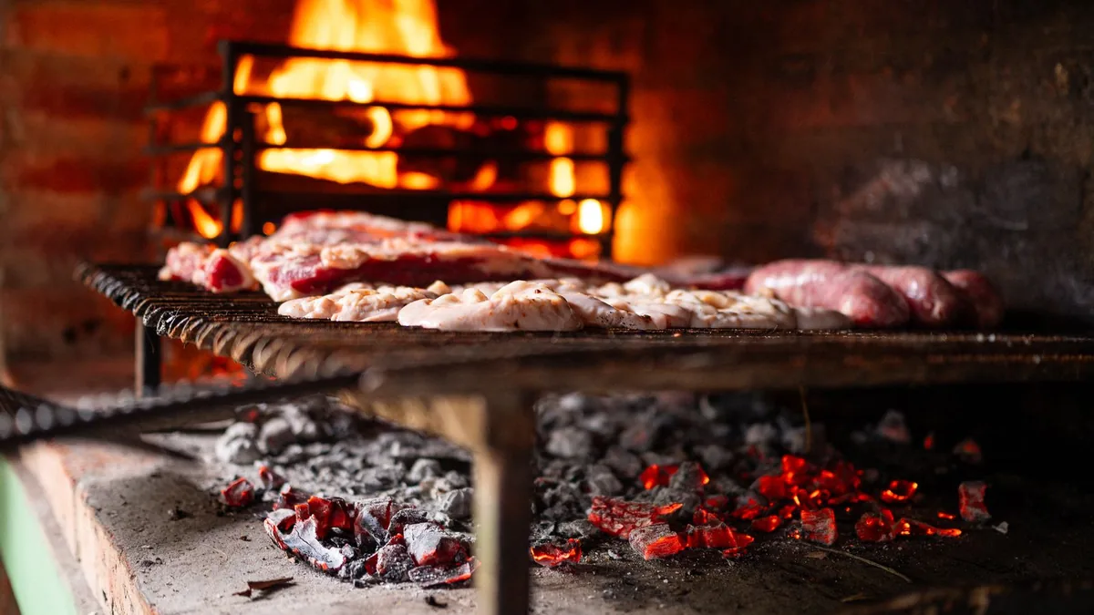 Barbeque techniques with glowing charcoal coals on a barbecue grill, ready for direct and indirect grilling