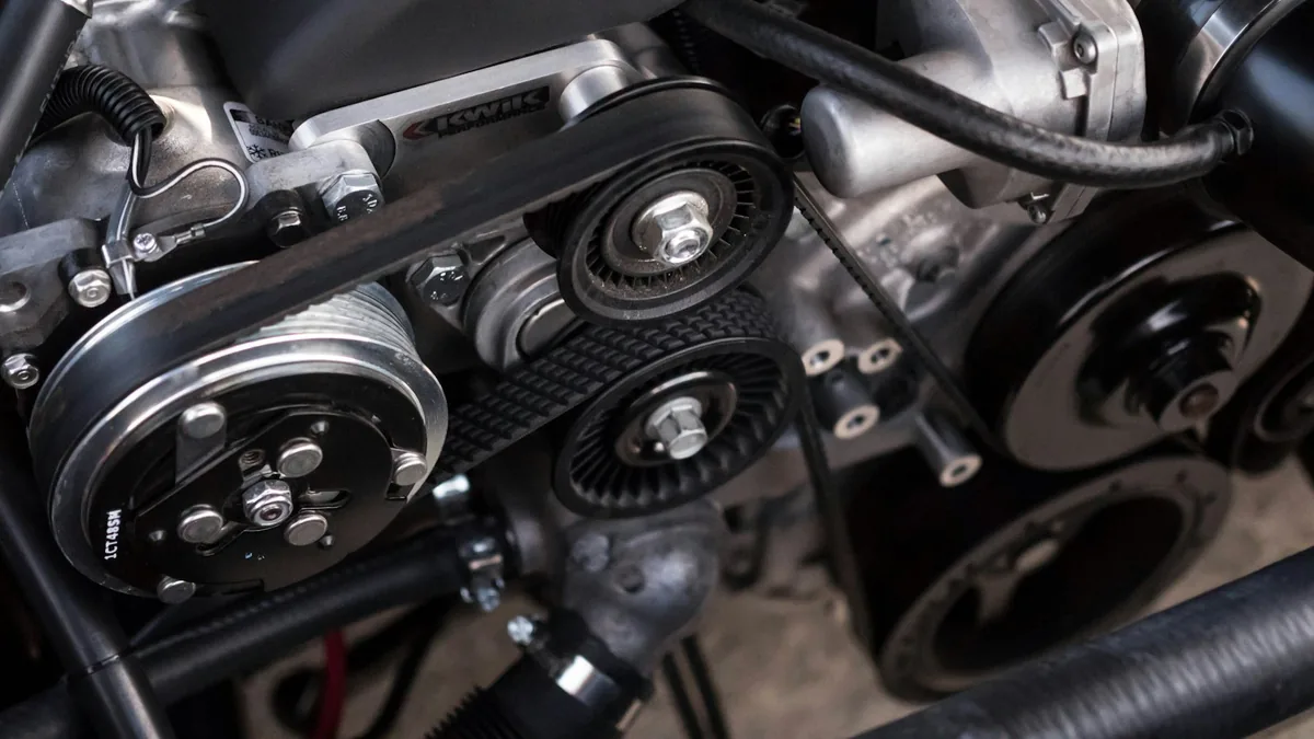 Open car engine bay showing a well-maintained engine during a full-service auto repair shop inspection